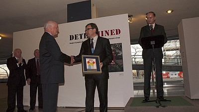 Mr James F. Lawrence, Acting Director PM/WRA receives the ITF Appreciation Plaque