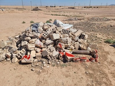 Explosive item located in a pile of scrap