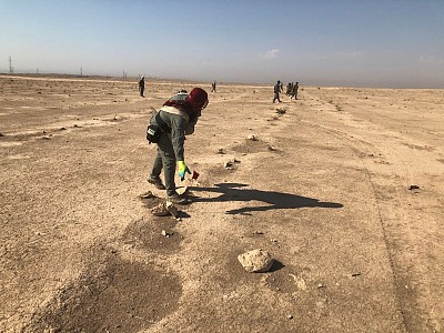 Battle area clearance teams picking up marking flags.